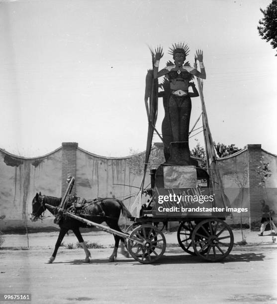 Horse trails behind a waggon with the inscription 'just imagine'. Iran.