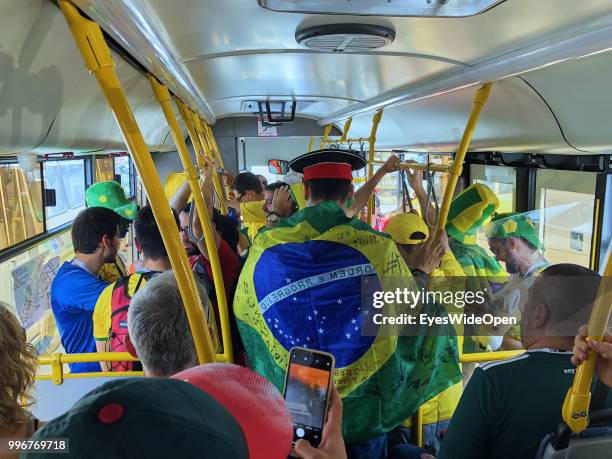 Brasilian fans in a public bus visit the FIFA World Cup football match beween Belgium and Brasil on July 9, 2018 in Kazan, Russia.
