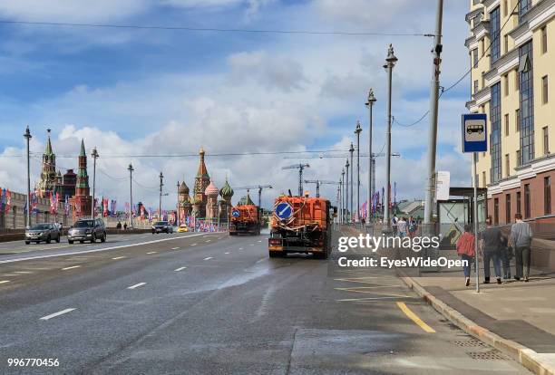 Trucks watering the streets against heavy dust near Red Square on July 9, 2018 in Moscow, Russia.