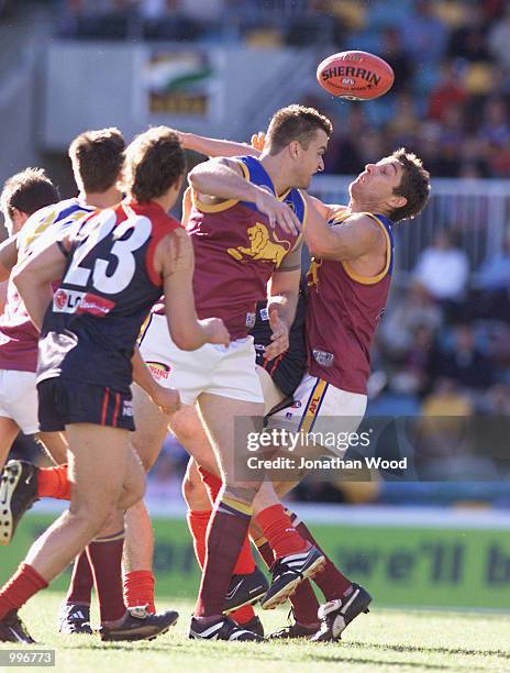 Alastair Lynch of the Lions attempts to catch a loose ball during the round 12 AFL match between the Brisbane Lions and the Melbourne Demons played...