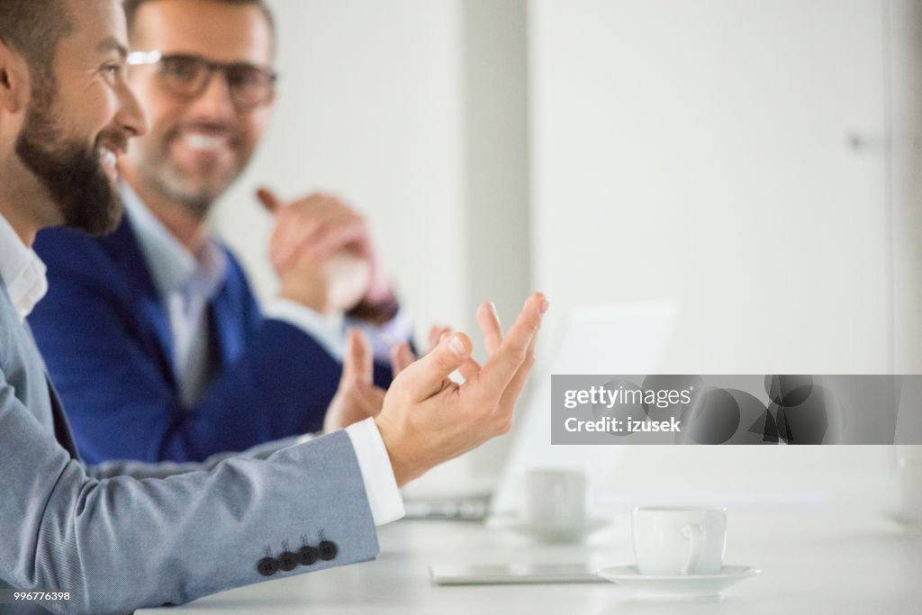 Happy business associates during meeting