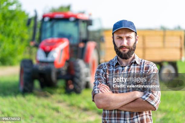 farmer standing with arms crossed - farmer arms crossed stock pictures, royalty-free photos & images
