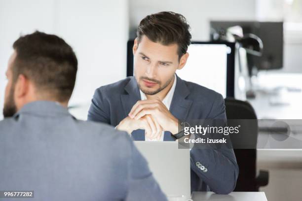 business team having meeting in office. - izusek stock pictures, royalty-free photos & images