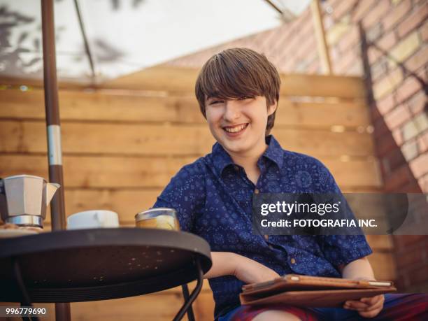 patio time with moter and son - fotografia stock pictures, royalty-free photos & images