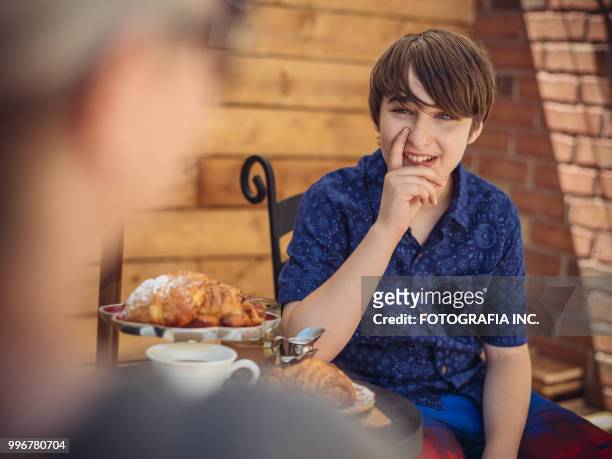 patio time with moter and son - fotografia stock pictures, royalty-free photos & images