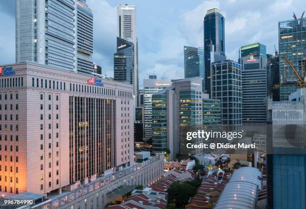 singapore business and financial district at dusk from high angle view in singapore - didier marti stock pictures, royalty-free photos & images