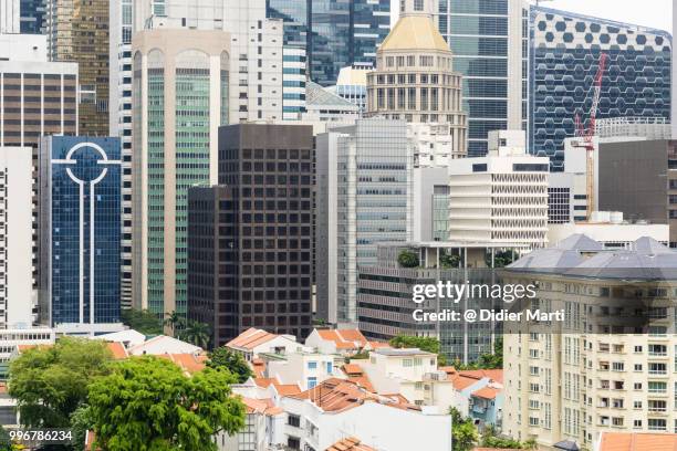 close up view of the skyscraper of singapore business and financial district - didier marti stock pictures, royalty-free photos & images