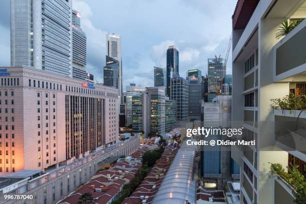 singapore business and financial district at dusk from high angle view in singapore - didier marti stock pictures, royalty-free photos & images