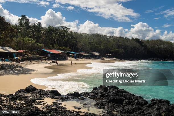remote beach near the village of padang bai in north bali in indonesia. - didier marti stock pictures, royalty-free photos & images