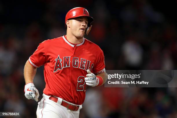 Mike Trout of the Los Angeles Angels of Anaheim flys out to end the ninth inning of a game against the Seattle Mariners at Angel Stadium on July 11,...