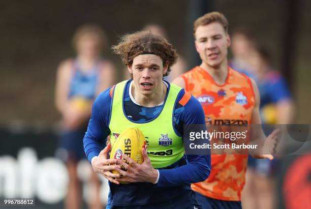 Ben Brown of the Kangaroo and Ben McKay of the Kangaroos compete for the ball during a North Melbourne Kangaroos Training Session on July 12, 2018 in...