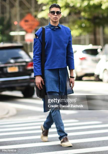 Guest is seen wearing a blue top and pants outside the Death to Tennis show during the 2018 New York City Men's Fashion Week on July 11, 2018 in New...
