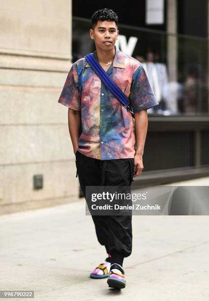 Guest is seen wearing a pastel shirt and black pants outside the Death to Tennis show during the 2018 New York City Men's Fashion Week on July 11,...