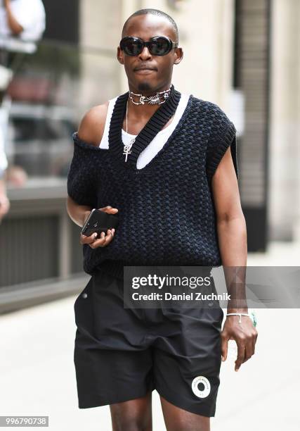 Guest is seen wearing a black sweater and black shorts outside the Death to Tennis show during the 2018 New York City Men's Fashion Week on July 11,...