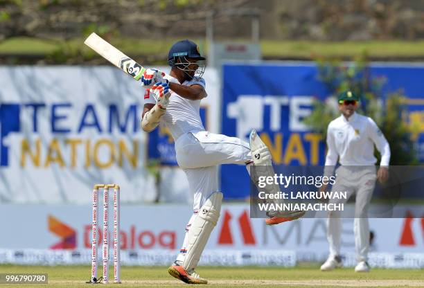 Sri Lankan cricketer Danushka Gunathilaka plays a shot during the first day of their opening Test match between Sri Lanka and South Africa at the...