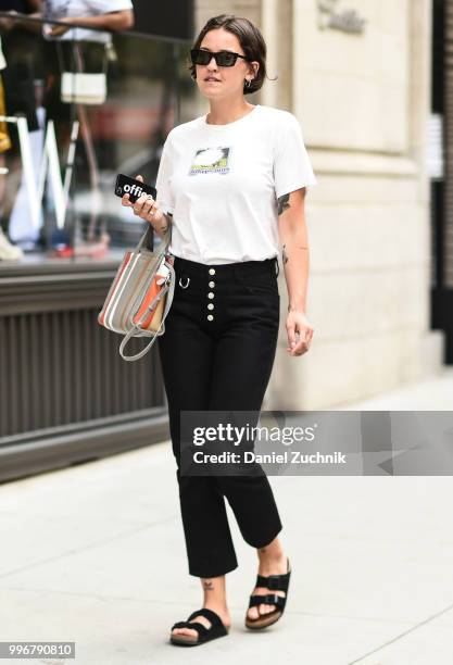 Guest is seen wearing a white shirt and black jeans outside the Death to Tennis show during the 2018 New York City Men's Fashion Week on July 11,...