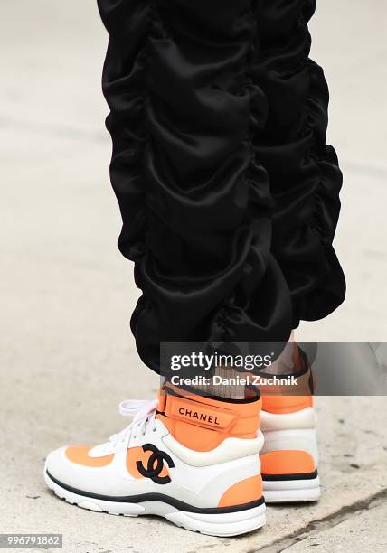 Guest is seen wearing Chanel sneakers outside the Death to Tennis show during the 2018 New York City Men's Fashion Week on July 11, 2018 in New York...