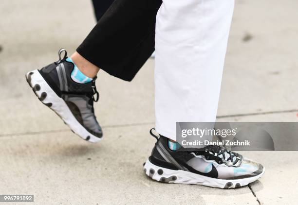 Guest is seen wearing Nike sneakers outside the Death to Tennis show during the 2018 New York City Men's Fashion Week on July 11, 2018 in New York...
