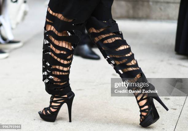Guest is seen wearing black heels outside the Death to Tennis show during the 2018 New York City Men's Fashion Week on July 11, 2018 in New York City.
