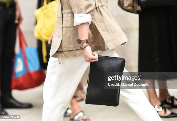 Guest is seen with a black bag outside the Death to Tennis show during the 2018 New York City Men's Fashion Week on July 11, 2018 in New York City.