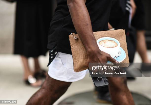 Guest is seen with a graphic latte bag outside the Death to Tennis show during the 2018 New York City Men's Fashion Week on July 11, 2018 in New York...