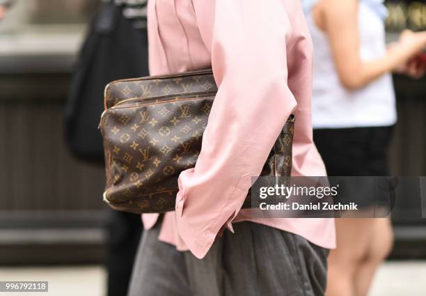 Guest is seen with a Louis Vuitton bag outside the Death to Tennis show during the 2018 New York City Men's Fashion Week on July 11, 2018 in New York...