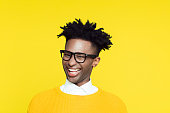Yellow portrait of nerdy young man making funny face