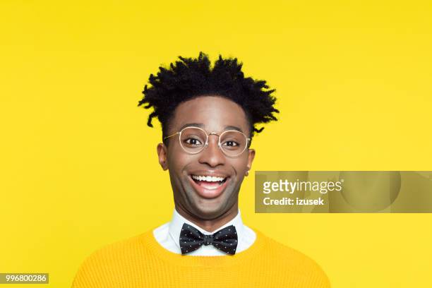 funny portrait of cheesy geeky young man laughing - izusek stock pictures, royalty-free photos & images