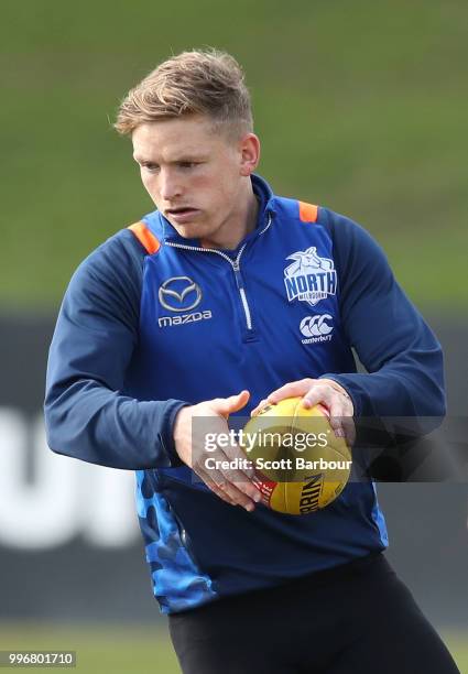 Jack Ziebell of the Kangaroos runs with the ball during a North Melbourne Kangaroos Training Session on July 12, 2018 in Melbourne, Australia.