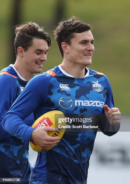 Scott Thompson of the Kangaroos runs with the ball during a North Melbourne Kangaroos Training Session on July 12, 2018 in Melbourne, Australia.