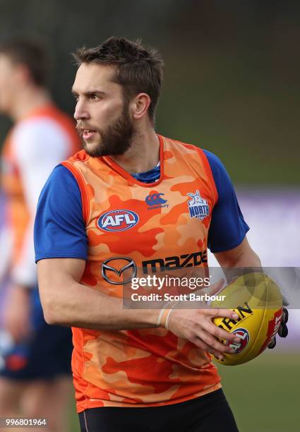 Jamie Macmillan of the Kangaroos runs with the ball during a North Melbourne Kangaroos Training Session on July 12, 2018 in Melbourne, Australia.