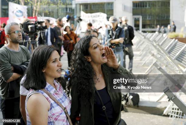 Woman shouts during a protest rally in Brussels, Belgium, on July 11 against U.S. President Donald Trump and other leaders of the North Atlantic...