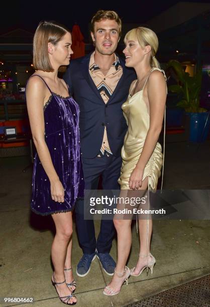 Maia Mitchell, Alex Roe, and Maika Monroe pose for portrait at the screening of A24's "Hot Summer Nights" afterparty on July 11, 2018 in Los Angeles,...