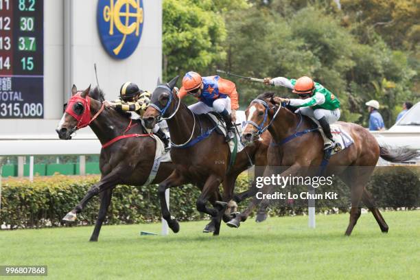 Jockey Karis Teetan riding Navel Orange wins Race 2 Harlech Handicap at Sha Tin racecourse on April 7 , 2015 in Hong Kong.