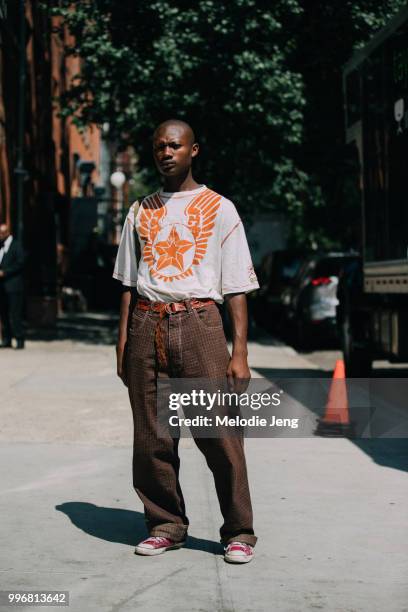 Aziz Milo wears a Coogi shirt during New York Fashion Week Mens Spring/Summer 2019 on July 11, 2018 in New York City.