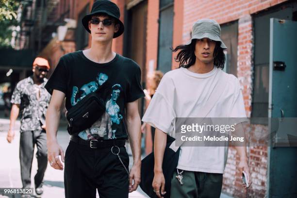 Models Julian Weigl, Hunter Chung both wear bucket hats during New York Fashion Week Mens Spring/Summer 2019 on July 11, 2018 in New York City....