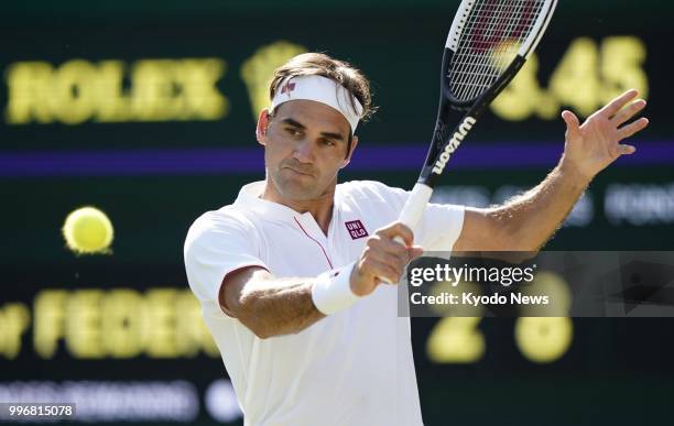 Roger Federer of Switzerland hits the ball during a quarterfinal match against Kevin Anderson of South Africa at Wimbledon in London on July 11,...