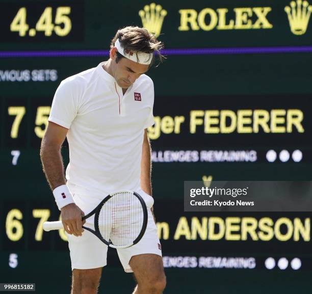 Roger Federer of Switzerland looks dejected after missing a point during a quarterfinal match against Kevin Anderson of South Africa at Wimbledon in...