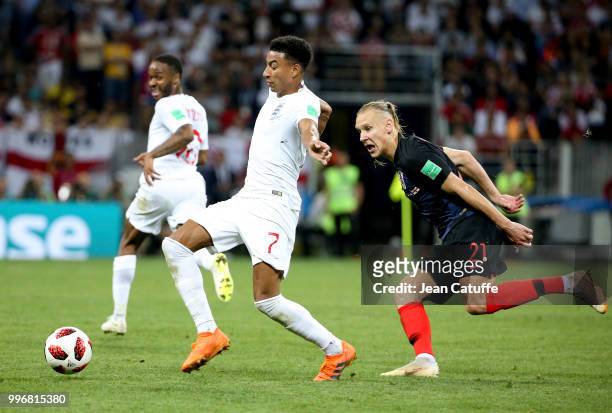 Jesse Lingard of England, Domagoj Vida of Croatia during the 2018 FIFA World Cup Russia Semi Final match between England and Croatia at Luzhniki...