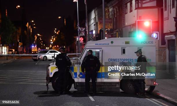 Police attend a suspect device left inside a car on the Newtownards road on July 11, 2018 in Belfast, Northern Ireland. Police have asked for calm...