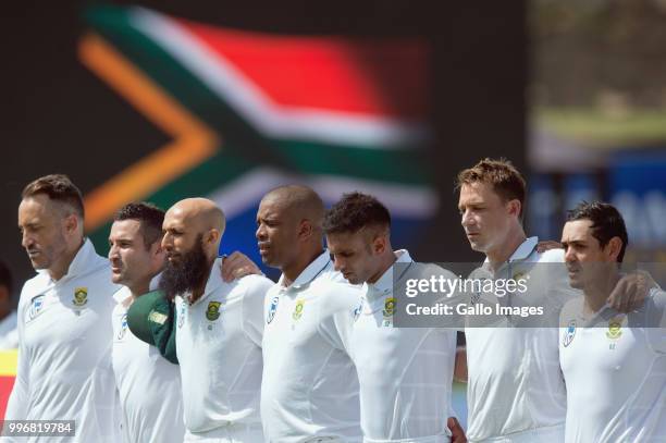 Faf du Plessis , Dean Elgar, Hashim Amla, Vernon Philander, Keshav Maharaj, Dale Steyn and Quinton de Kock of South Africa sings the national anthem...