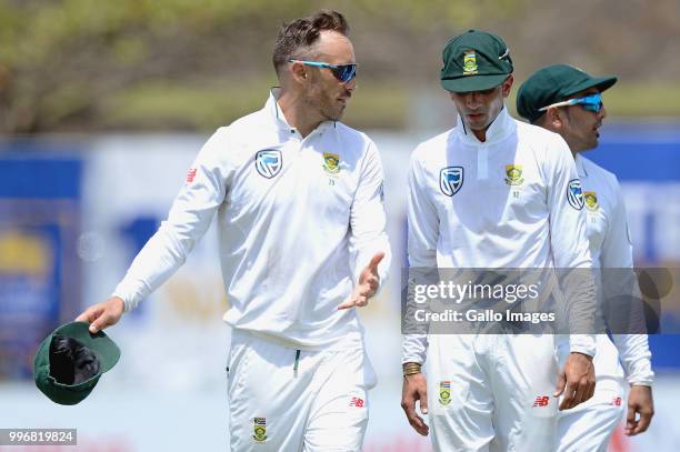 Faf du Plessis captain of South Africa having a chat with Keshav Maharaj while walking to the dressing room for the lunch during day 1 of the 1st...