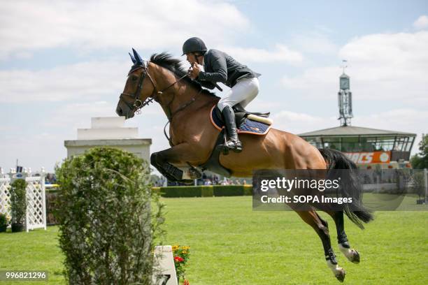 Participant seen riding a horse while jumping over an obstacle during the Great Yorkshire Show 2018 on day one. The Great Yorkshire Show is the...