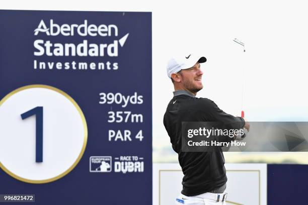 Chris Wood of England tees off on hole one during day one of the Aberdeen Standard Investments Scottish Open at Gullane Golf Course on July 12, 2018...