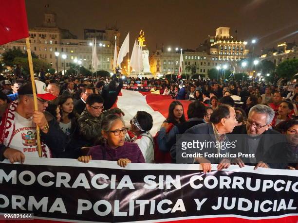 Democracy without corruption " banner held by the crowd when citizens take to the streets of Lima and occupy the San Martin square and Justice Palace...