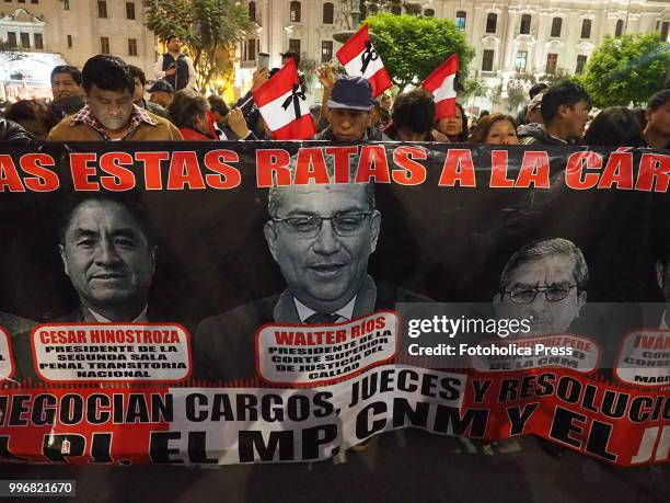 Send these rats to the jail" banner held by a group of people when citizens take to the streets of Lima and occupy the San Martin square and Justice...