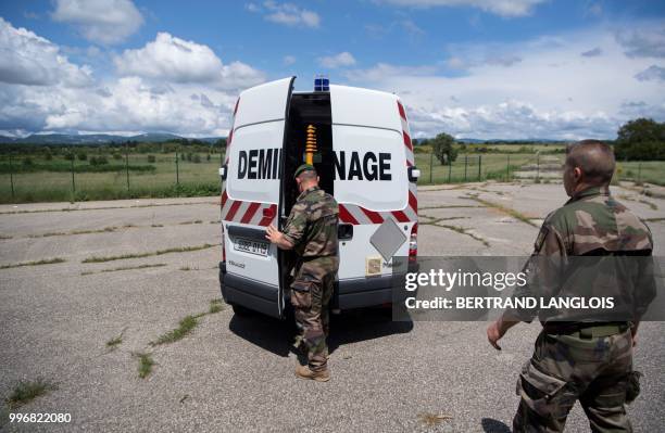 French army legionnaires get ready to practice a mine-clearing exercice in Saint-Christol, southern France, on June 12, 2018.