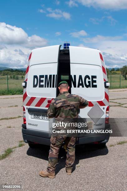 French army legionnaires get ready to practice a mine-clearing exercice in Saint-Christol, southern France, on June 12, 2018.