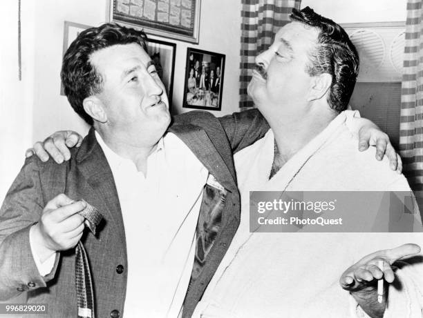 View of Irish poet and author Brendan Behan & American comedian and actor Jackie Gleason in the latter's dressing room at the Shubert Theatre, New...