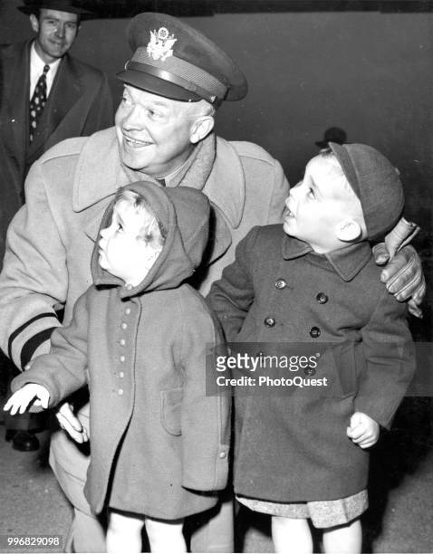 American NATO Supreme Commander General Dwight D Eisenhower poses with his grandchildren, Barbara Anne Eisenhower and Dwight David Eisenhower II, at...